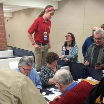 Lilian watches votes being counted at a Republican caucus at Urbandale High School in Iowa.