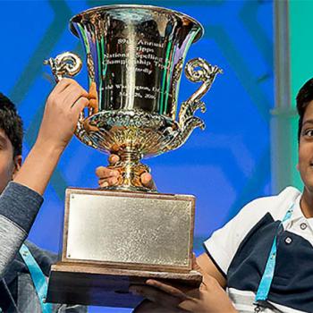 Nihar Janga (left) and Jairam Hathwar hoist the Scripps National Spelling Bee trophy after being named co-champions on May 26 in National Harbor, Maryland.