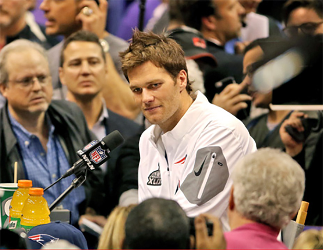 New England Patriots quarterback Tom Brady answers questions at Super Bowl Media Day.